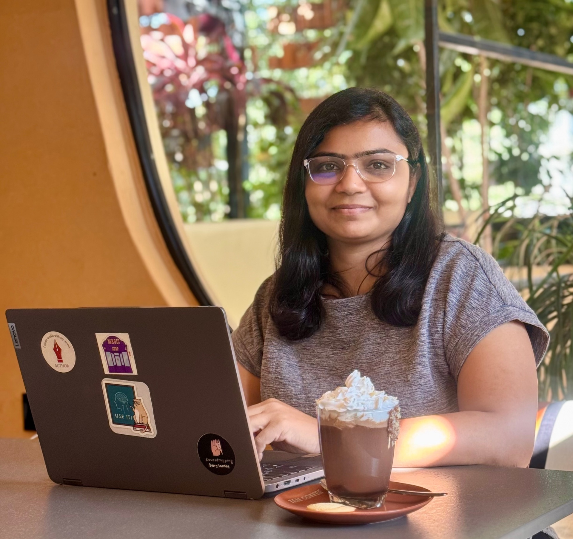 Alisha Jain working at a café